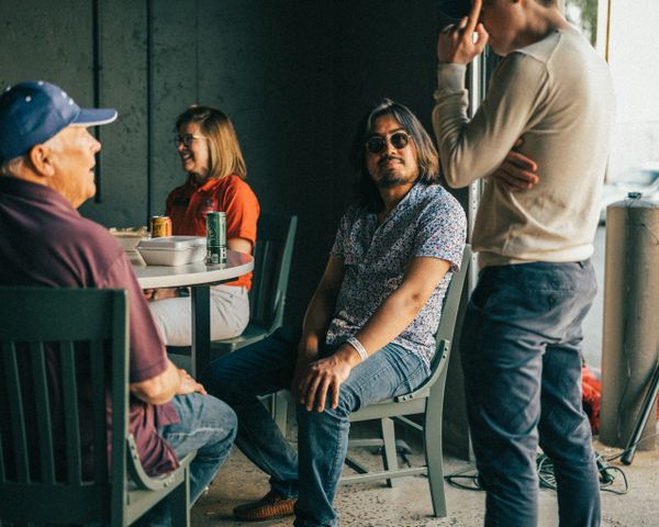 Porsche club members chatting at Wolfpen European Auto Repair in Roswell, Georgia