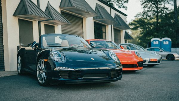Line of Porsche 911 sports cars outside Wolfpen European Auto Repair in Roswell, Georgia