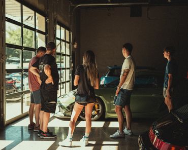 Customers admiring Porsche GT4 RS at Wolfpen Euro Auto Repair in Roswell Georgia