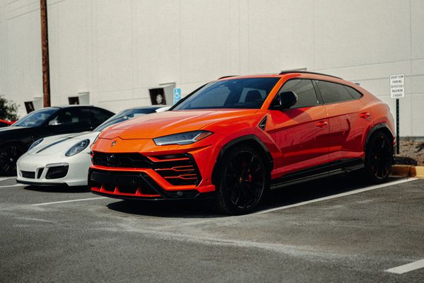 Lamborghini Urus and Porsche 911 outside Wolfpen in Roswell, Georgia for Wolfpen Wednesday