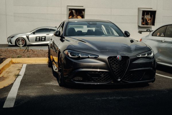 Alfa Romeo Giulia Quadrifoglio outside Wolfpen European Auto Repair in Roswell GA with Lexus RC-F