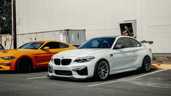 BMW M2 and Ford Mustang GT outside Wolfpen European Auto Repair in Roswell Georgia for Wolfpen Wedne