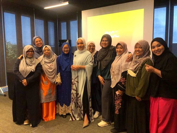 group of ladies smiling confidently.