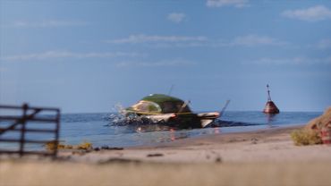 A barrowcar, in hydrodrive, drives onto Lake Mibuki.