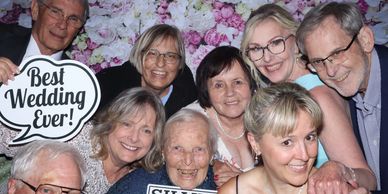 Group of senior people smiling at a wedding.