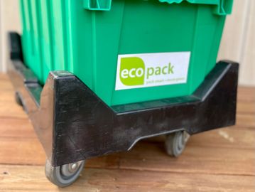 A dolly with wheels to conveniently stack up to four  EcoPack rental moving boxes to transport items