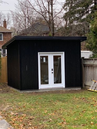 Custom Built Shed in Leaside area of Toronto with a shed style roofline, concrete pad, steel siding