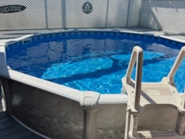 Above-ground pool with bright blue liner and sturdy frame after replacement