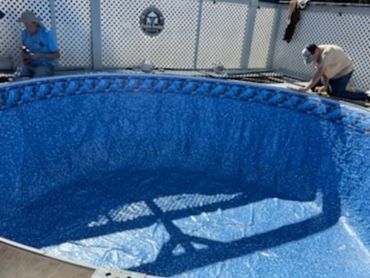 Above-ground pool liner installation in progress in Pensacola, FL