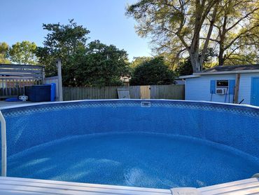 Clean above-ground pool after algae removal and pool cleaning in Pensacola, FL