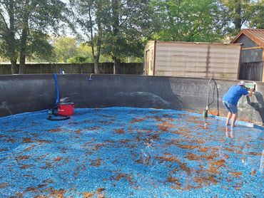 Above-ground pool with old liner and debris before liner replacement in Pensacola, FL