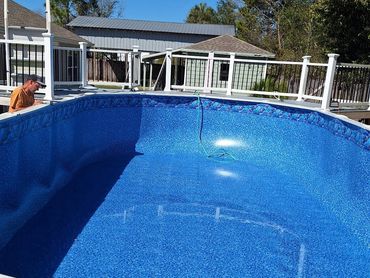 Above-ground pool with new liner installed after liner replacement in Pensacola, FL
