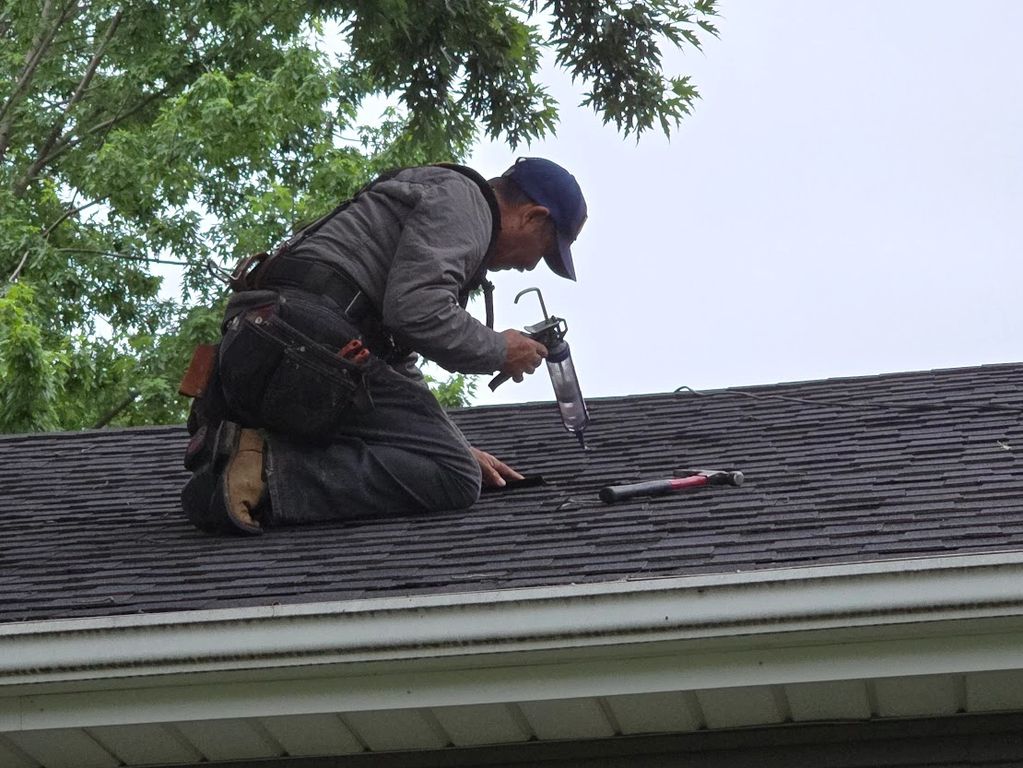 Local roofer fixing a roof