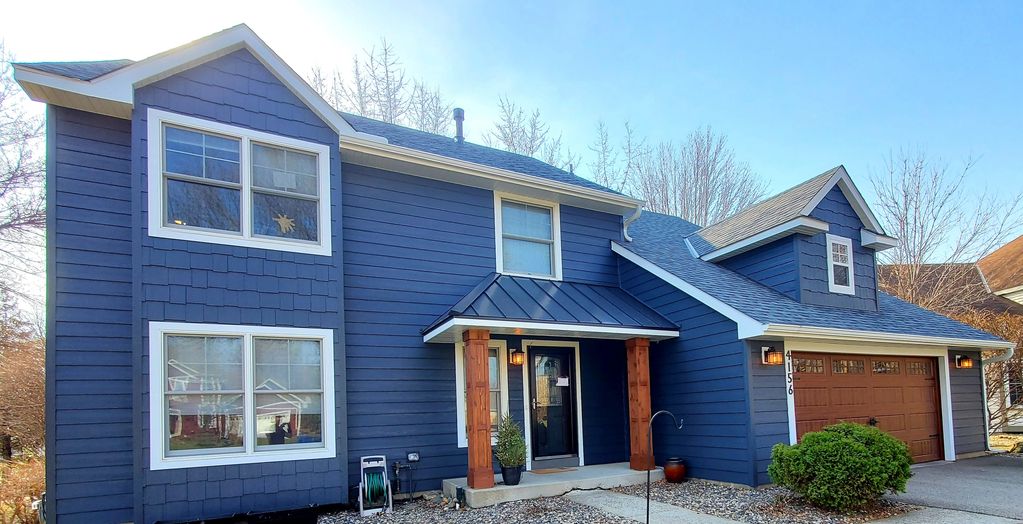 Owens Corning Roofing, LP Smartside siding, soffit and fascia, gutters, and garage door project