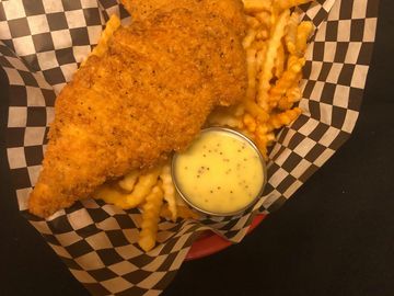 Chicken Tenders fries and honey mustard sauce in a basket
