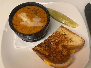 Soup and sandwich on a plate