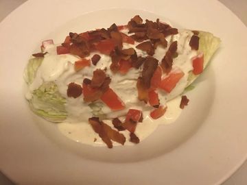a Side wedge salad in a bowl