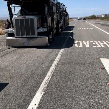 Car hauler needed a tire replaced. Emergency Tire Replacement on the I-10 Fwy in Chiriaco Summit.