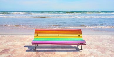 Rainbow, park bench, colourful, beach LGBTQI, LGBTIQ, lonely, loneliness, grief, sunny day, ocean