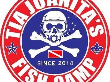 Logo for Tia Juanita's Fish Camp featuring a scuba skull and crossbones.