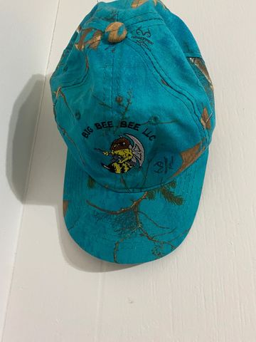 Big Bee Bee LLC logo embroidered on blue camo hat