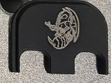 Glock backplate with a custome Big Bee Bee LLC logo laser engraved into it