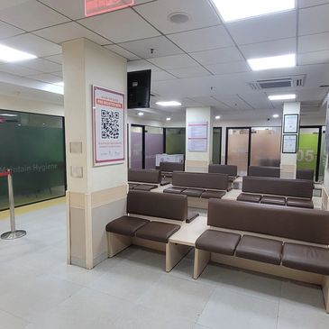 Empty waiting area with brown seats in a medical or office facility.