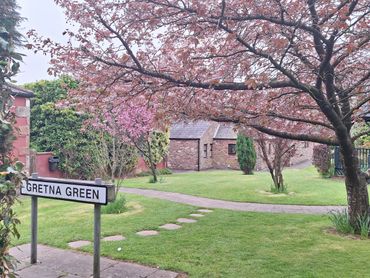 The gardens and grounds of The Mill Forge Hotel near Gretna Green