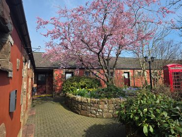 The gardens and grounds of The Mill Forge Hotel near Gretna Green