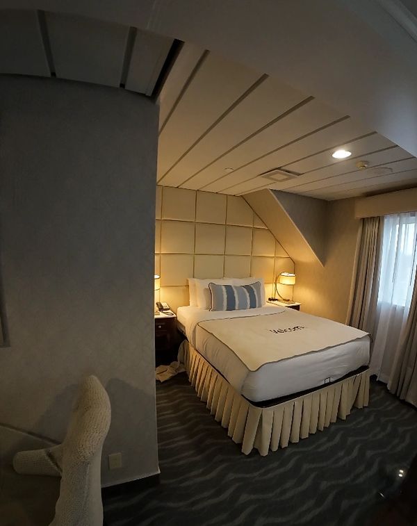 Queen bed, with bedside tables and reading lights,