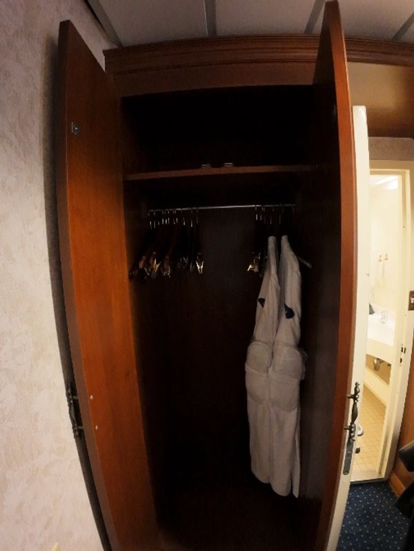 Ample closet storage, with robes and slippers.