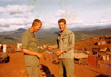 Richard Smith B Battery 4th 42ndLast day out in the field, handing off smoke grenade to the Battery