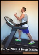A man walking on steep treadmill incline while connecting himself with the treadmill safety waist belt.