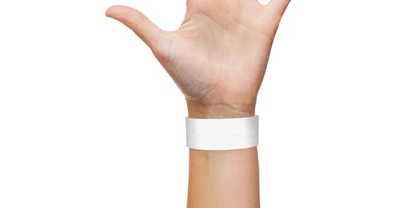 Hand with blank white wristband on a white background.
