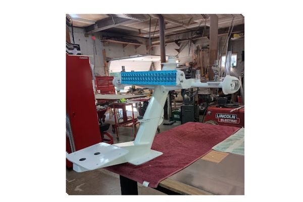 A specialized gray military or surveillance ship with multiple radar domes and antenna masts