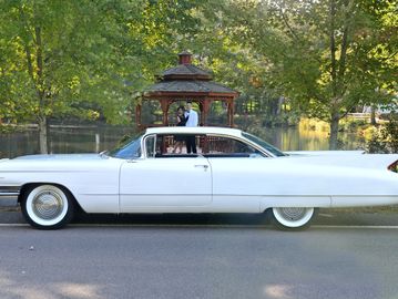 1960 Cadillac coupe white tailfins 1950s style fins rocket age refined wedding car for hire classic