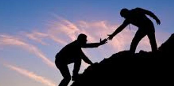 Figures in silhouette, one helping the other.