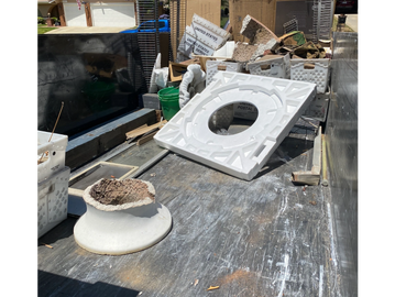 Small quarter load junk removed from the side of customers home.