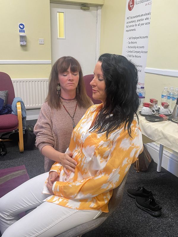 reiki students practising hands on healing