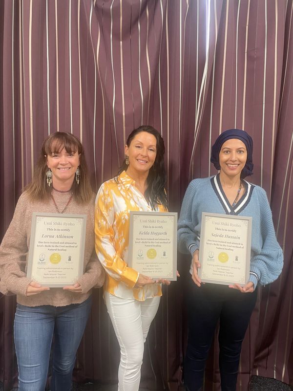 smiling happy reiki students