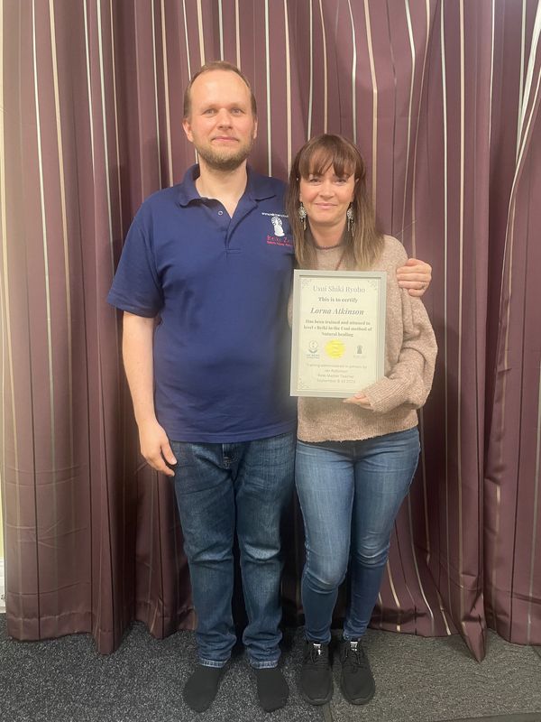 Ian Reiki master teacher with student