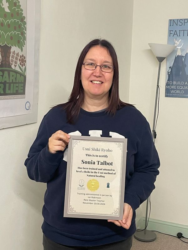 Reiki level 2 student with certificate