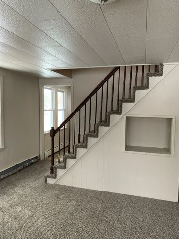 Living room & stairs to upstairs bedrooms and bathroom