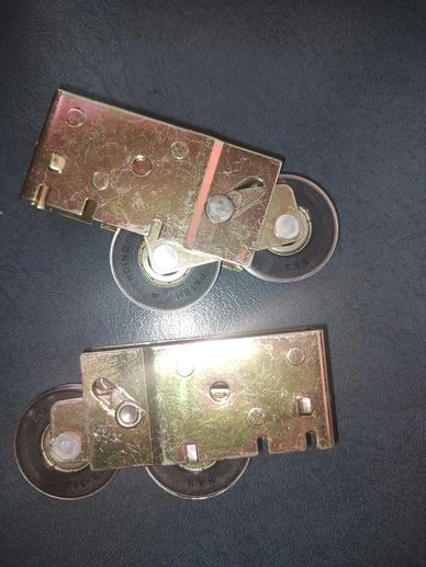 Set of stock roller housings that the bearings were swapped out to get our standard of ease of use