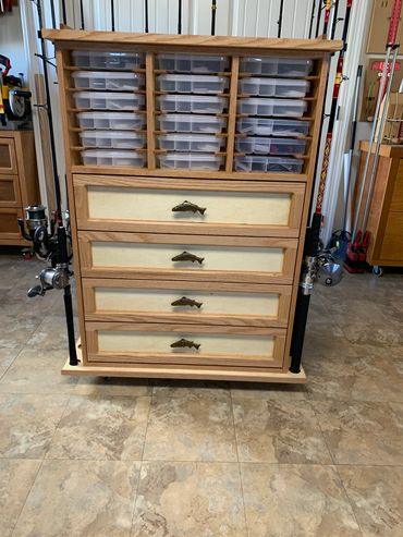 Custom fishing tackle center, 18 Plano 3700 boxes, 4 drawers and 16 rod holders.