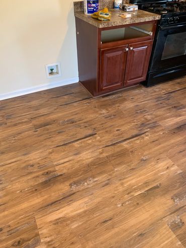 New laminate flooring with shoe moulding.