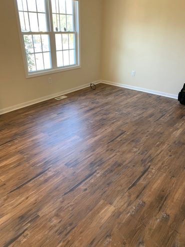 New laminate flooring with shoe moulding.