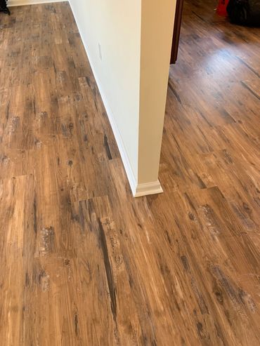 New laminate flooring with shoe moulding.