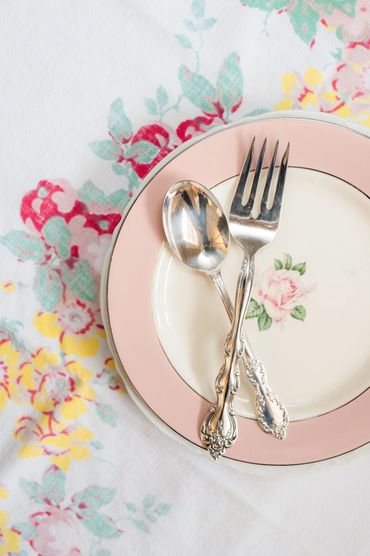dessert plate with silverware on a vintage table cloth