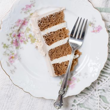 Vintage floral patterned dessert plate with a slice of wedding cake